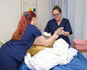 CNA nursing students in lab