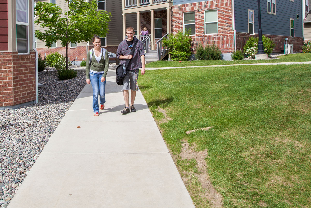 Students talking and walking on campus