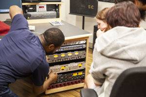 Music Tech students learning about recording hardware