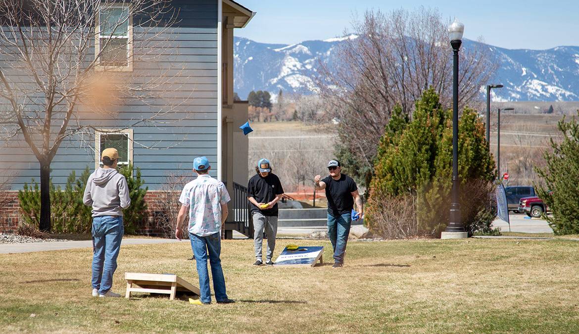 Students play a game of Corn Hole at Sheridan College