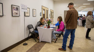 Student receiving information on financial aid during walk in wednesday at Sheridan College