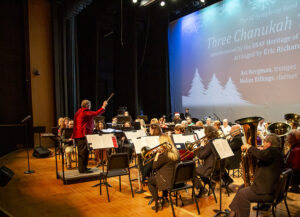 Eric Richards conducts during Holiday Swing performance photo