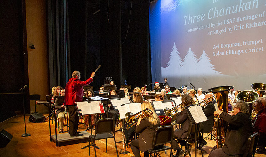 Eric Richards conducts during Holiday Swing performance photo