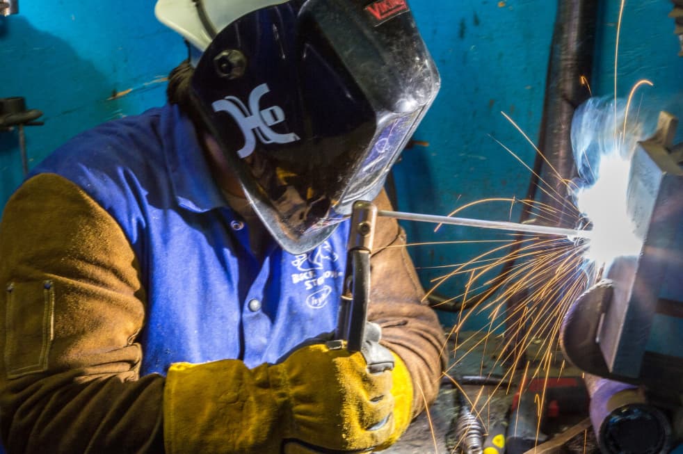 Photo of Sheridan College welding student.