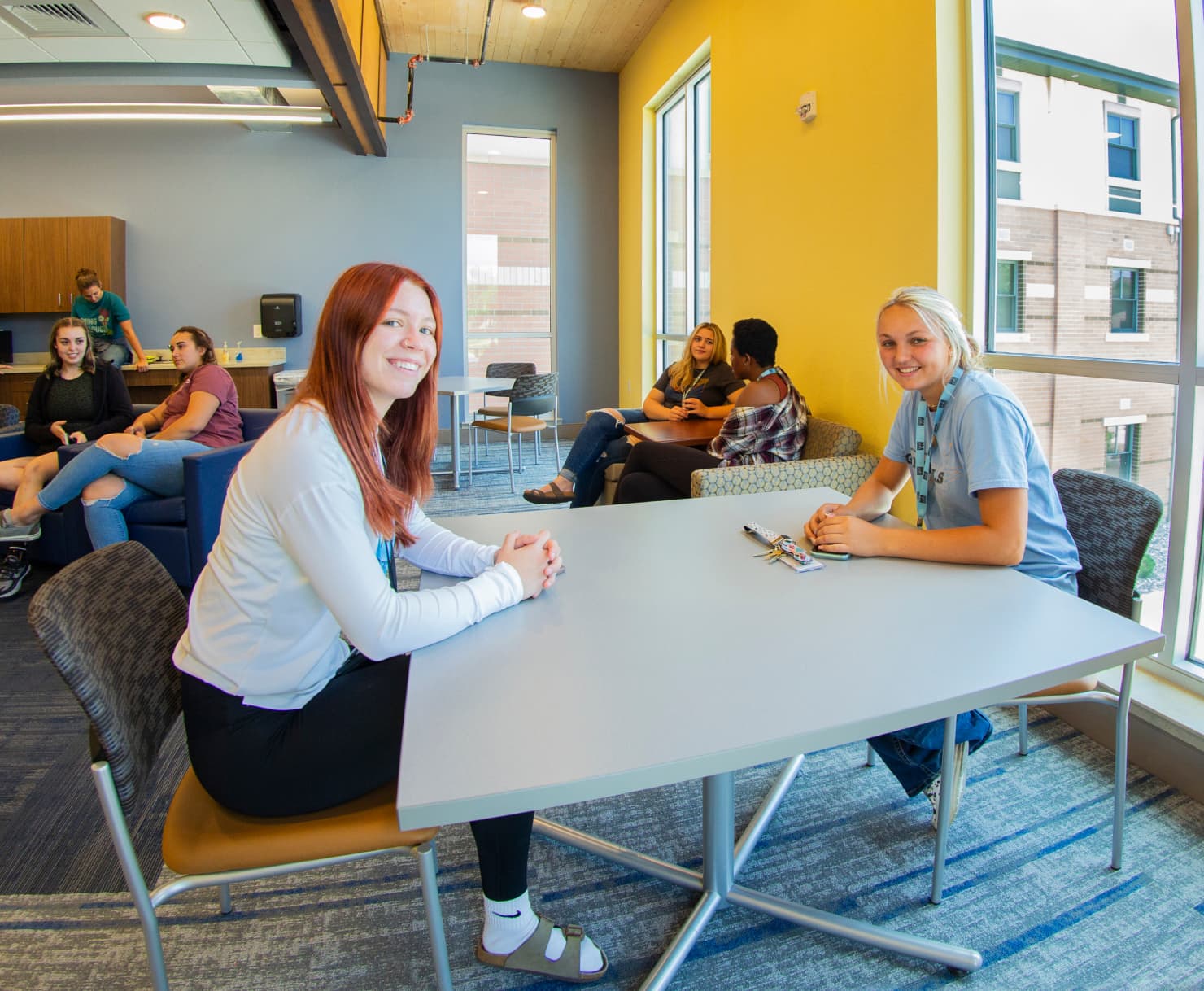 Sheridan College students hanging out in the commons area of Centennial Hall.