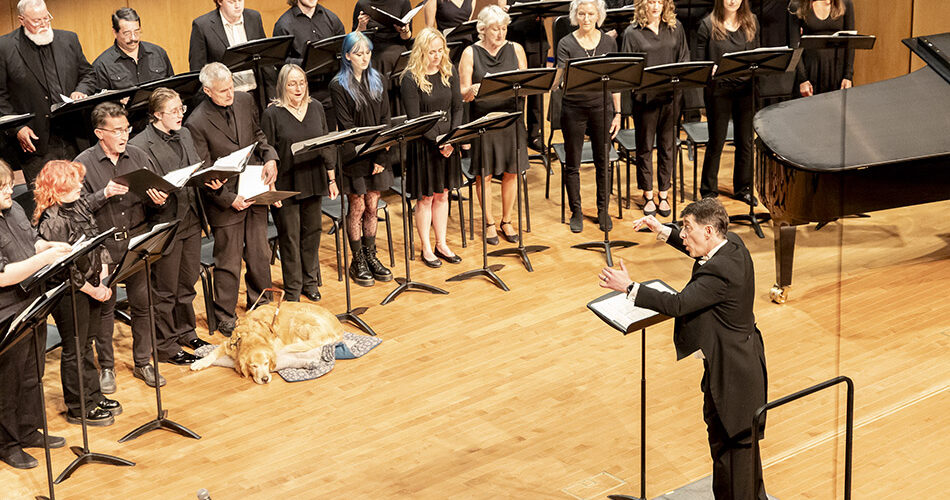 Photo of the Sheridan College Collegiate Choir performing with Dr. Robert Psurny directing.