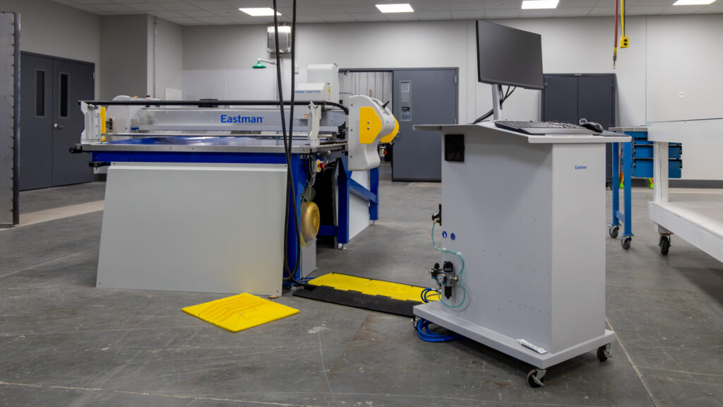 Automated digital cutting system used for precision cutting, pattern development, prototyping, composite manufacturing, and advanced material processing. 