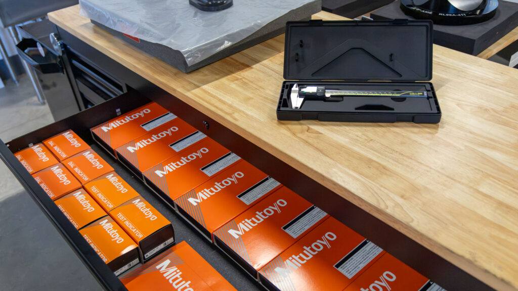 Mitutoyo Digital Calipers displayed in a tool box and on display on top of tool box.