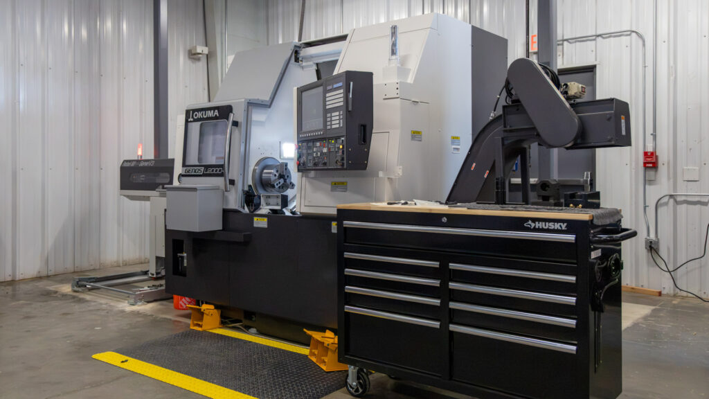 GENOS L2000-e MY x380 with Rebel 80 Servo V3 Bar Feeder is a multi-axis turning center with Y-axis, live tooling, hydraulic tailstock, and servo bar feeding for efficient unattended machining of precision components. 