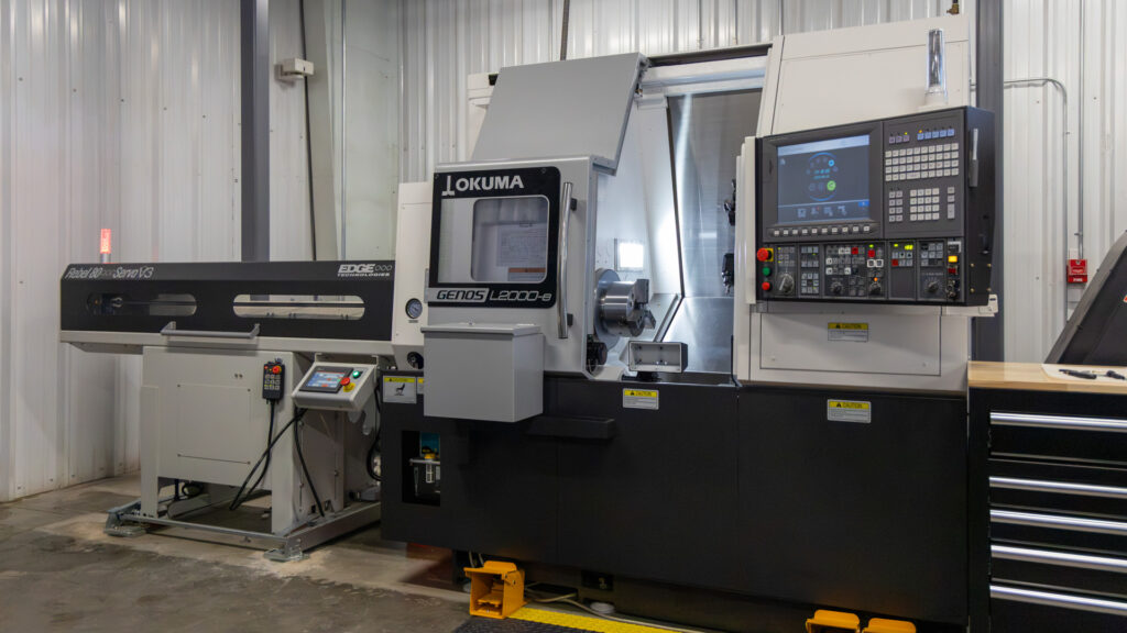 GENOS L2000-e MY x380 with Rebel 80 Servo V3 Bar Feeder is a multi-axis turning center with Y-axis, live tooling, hydraulic tailstock, and servo bar feeding for efficient unattended machining of precision components. 

8" Chuck | 1.5" Bar Capacity | 2.44" Spindle Bore | 5,000 RPM Main Spindle | 6,000 RPM Live Tools | X6.5" Y3.1" Z15.7" | 12-Station VDI Turret | Hydraulic Manual-Position Tailstock | Rebel 80 Servo V3 Bar Feeder | OSP-P300LA-e Control 