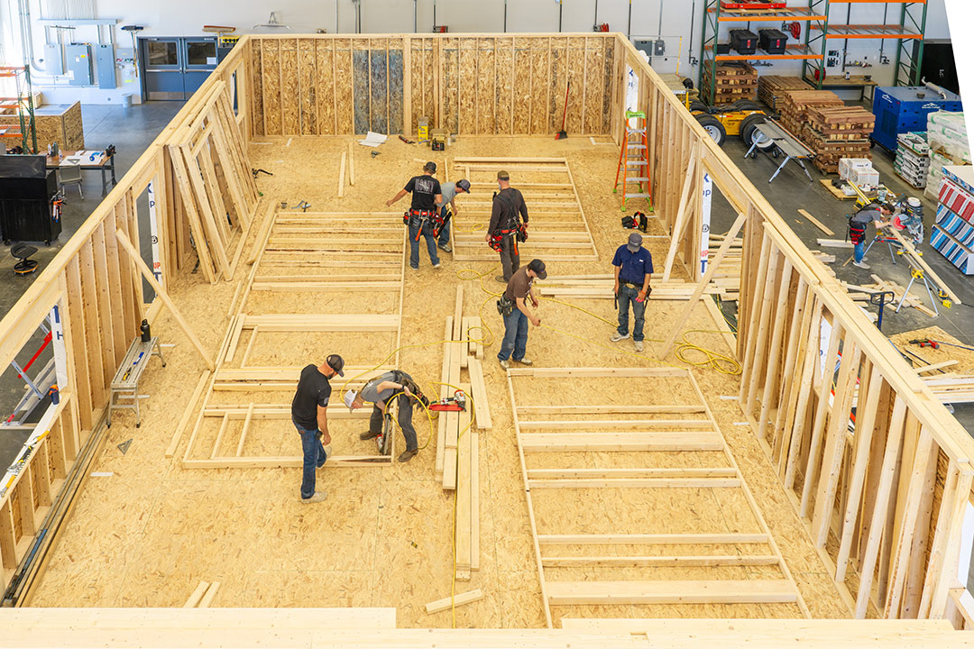 Sheridan College Construction Technology students build a house inside the Innovation Center.