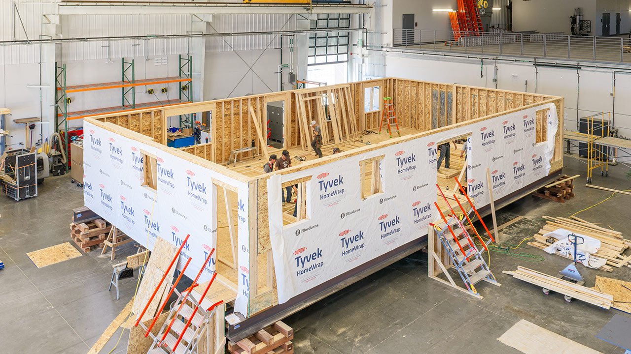 Sheridan College Construction Technology students build a house inside the Innovation Center.