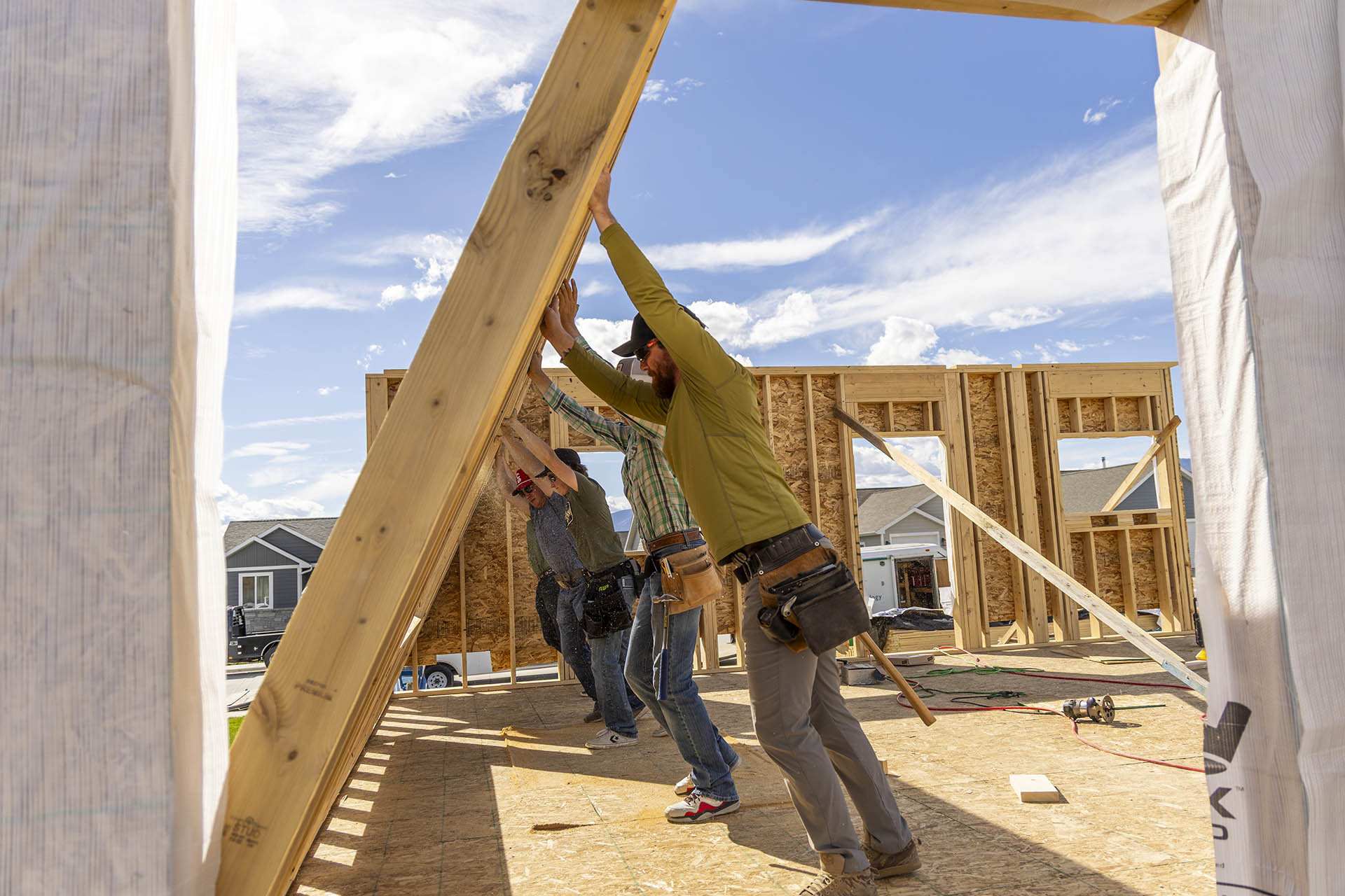 Construction technology program pushing up a wall at a building site