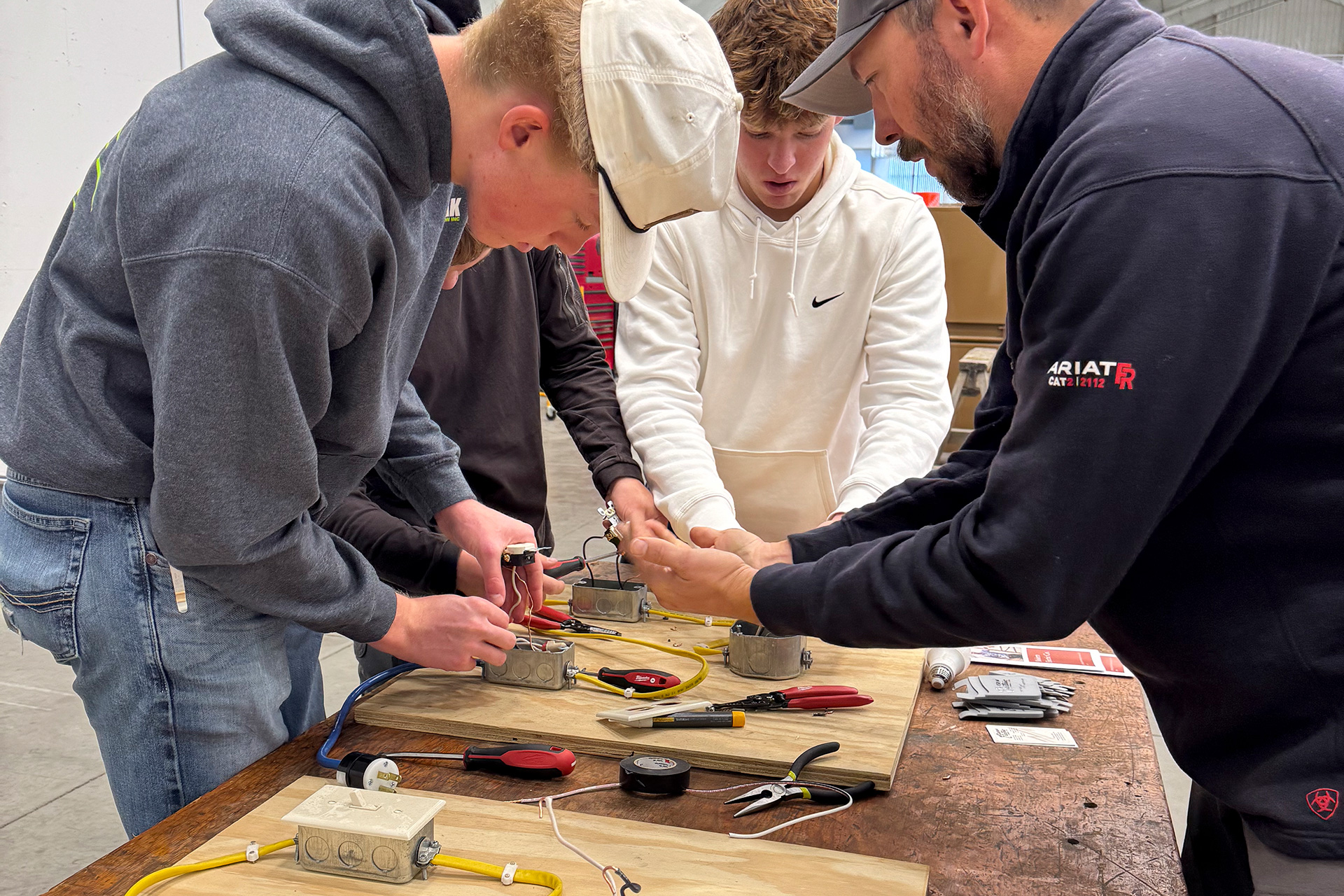 Sheridan College electrical class with students and an instructor.