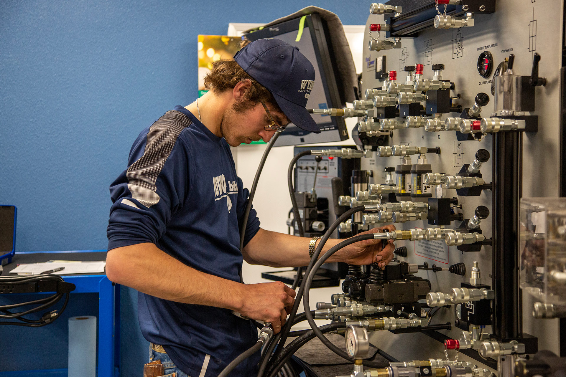 Sheridan College student working on a hydraulic station in the diesel technology program.
