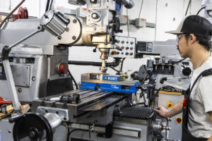 Machine Tool student using a traditional press