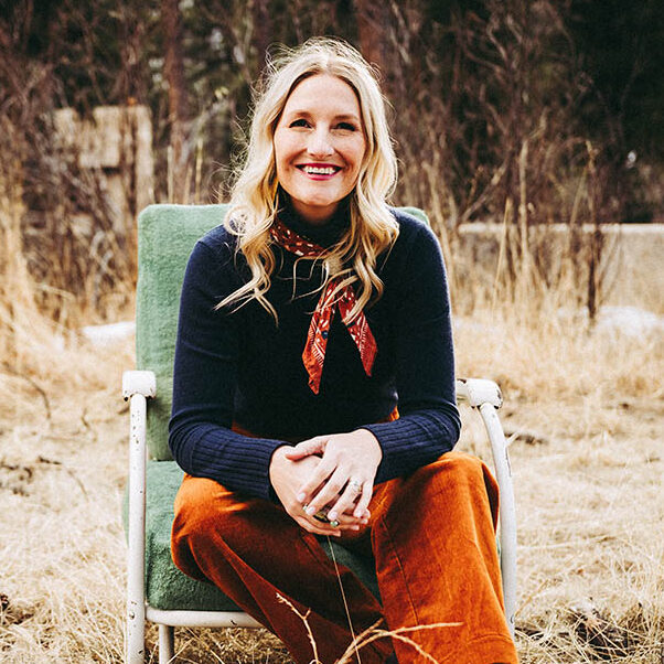 Photo of Sarah Sample sitting in a chair outside