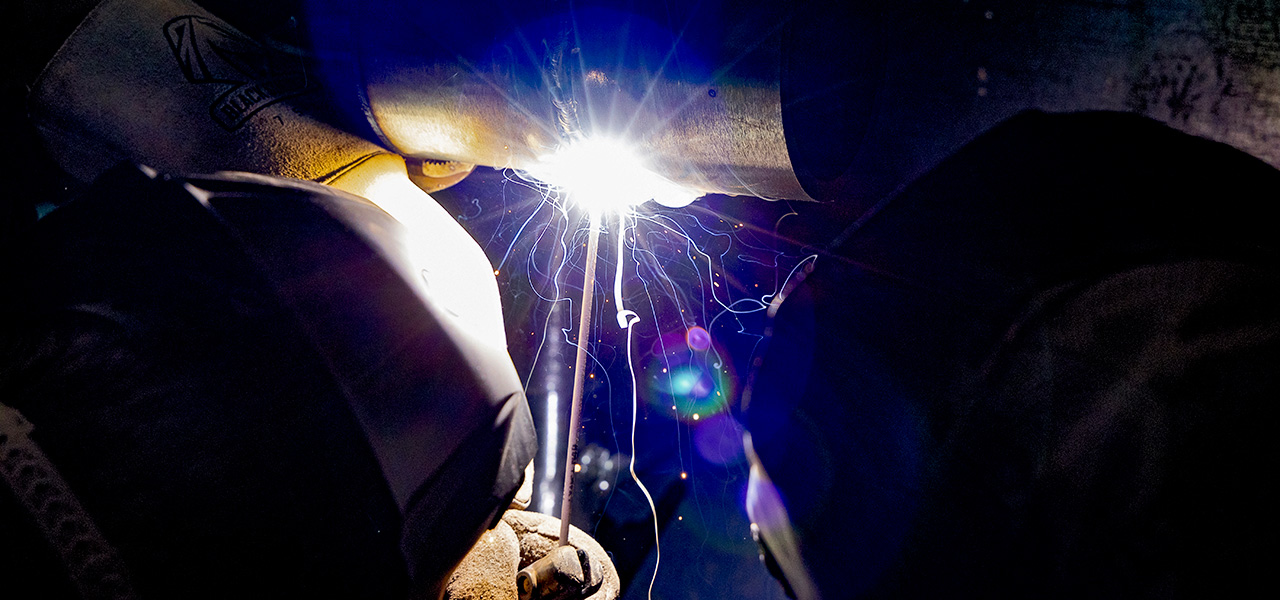 Sheridan College student welding.
