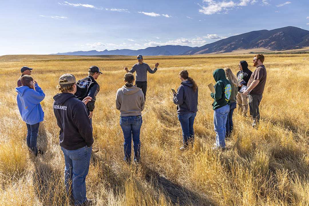 Sheridan College ecology students outside in one of our many field labs with the mountains and brilliant blue sky behind them.