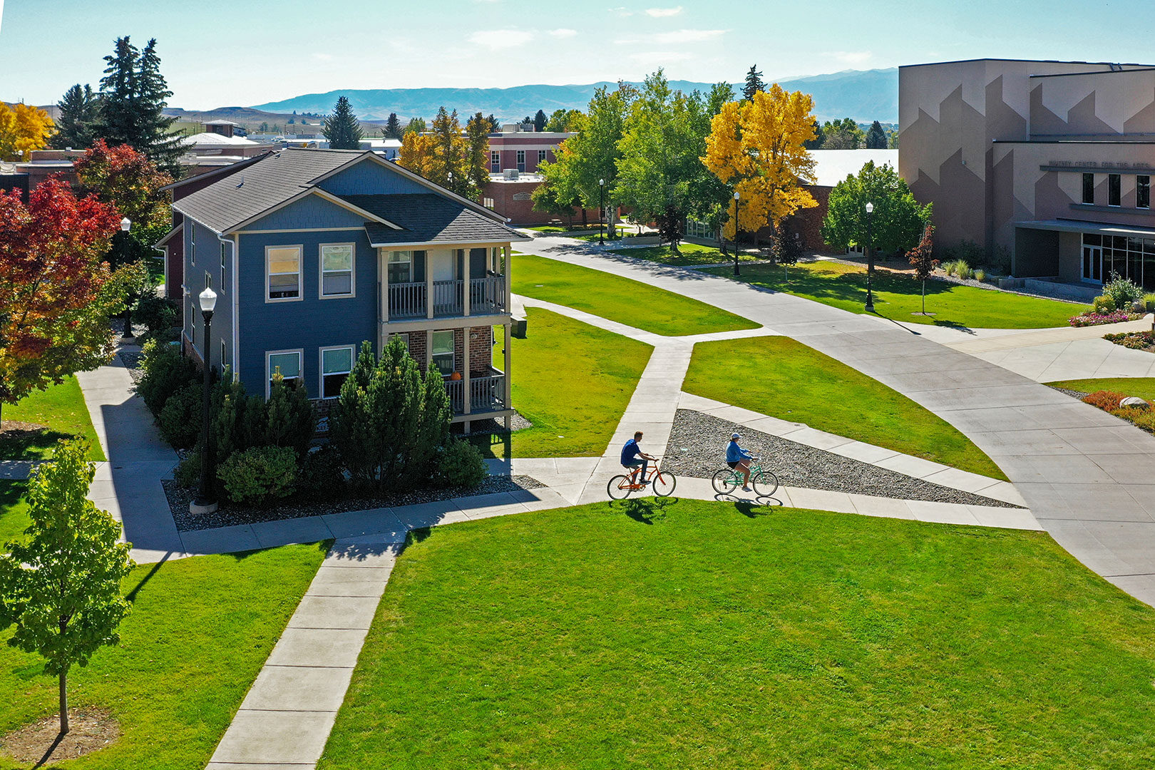 Sheridan College campus with students riding bikes