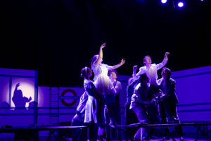 Theater students performing a production of Alice by Heart at the WYO Theater