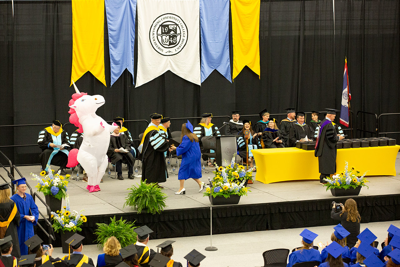 Sheridan College graduation photo with unicorn.