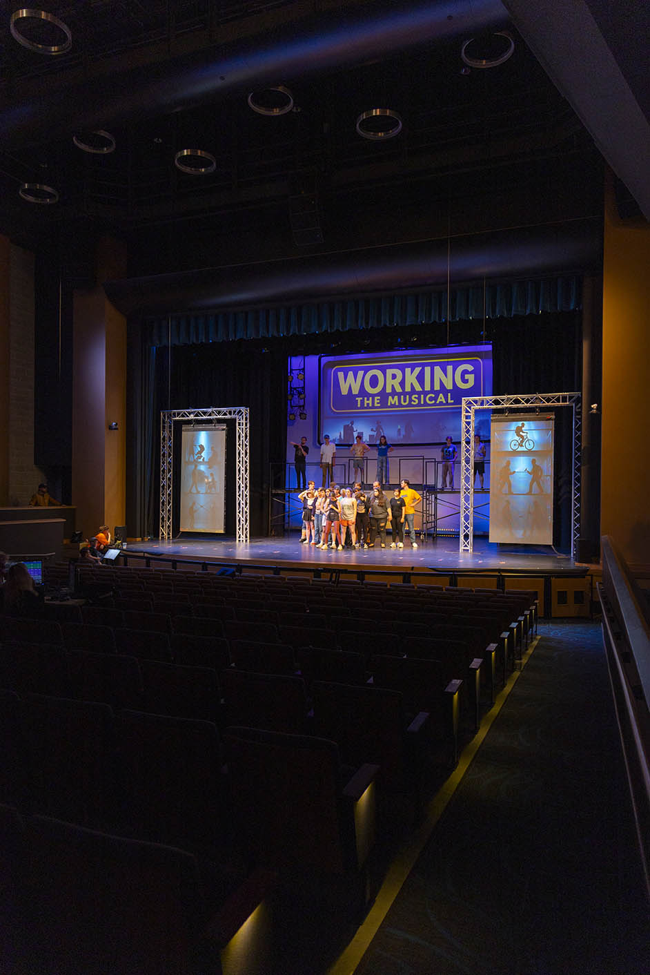 Actors on stage during a rehearsal of Working, a musical, at Sheridan College