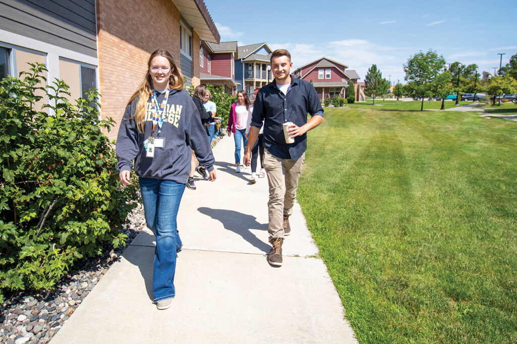 Students walking past Whitney Villas
