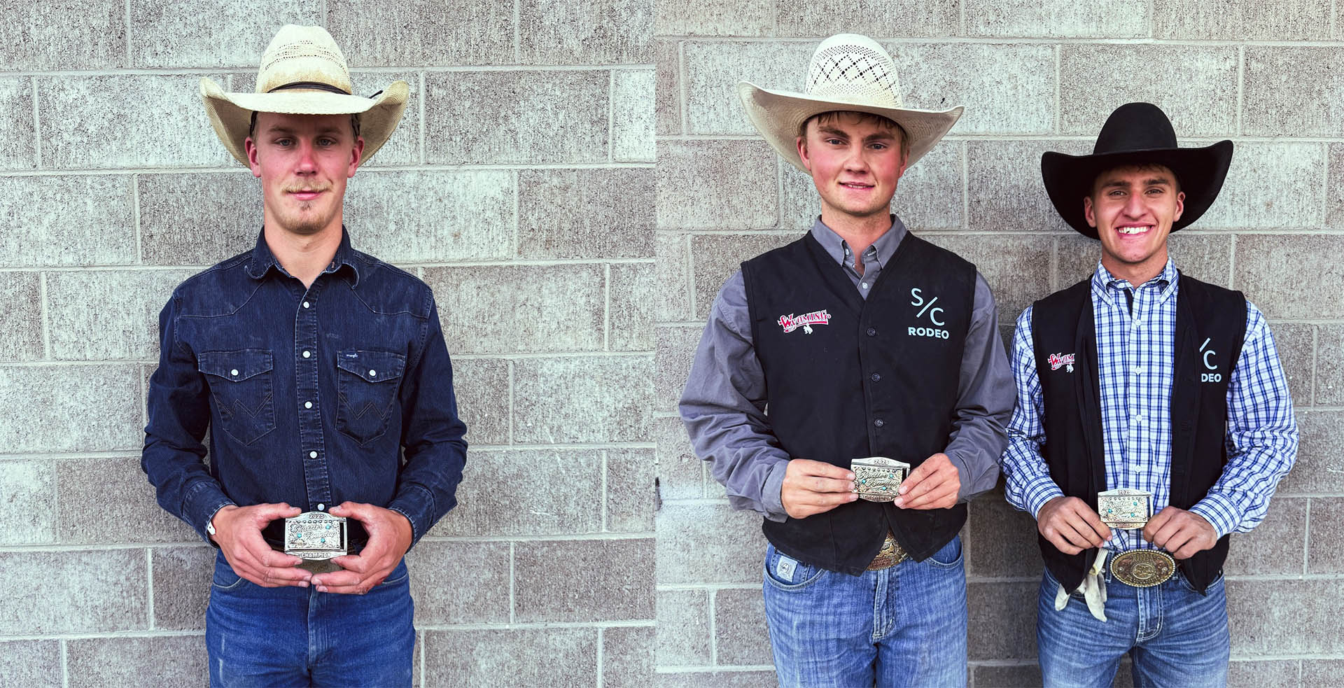 Three rodeo athletes holding their winning buckles