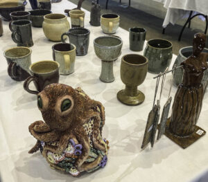 image showing a colorful sculpture of an octopus and some ceramic mugs