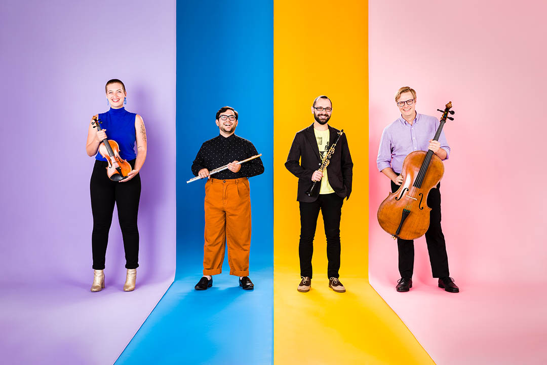 Colorful photo of the Hub New Music quartet holding their various intstruments