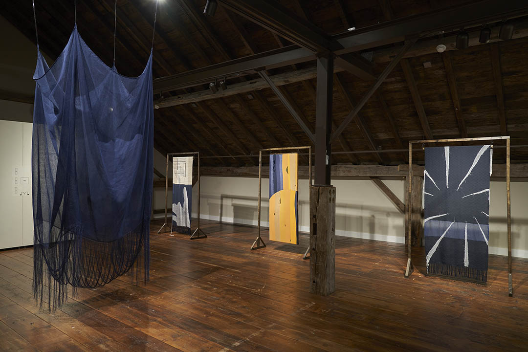 Image of several Kimberly English textile pieces on display