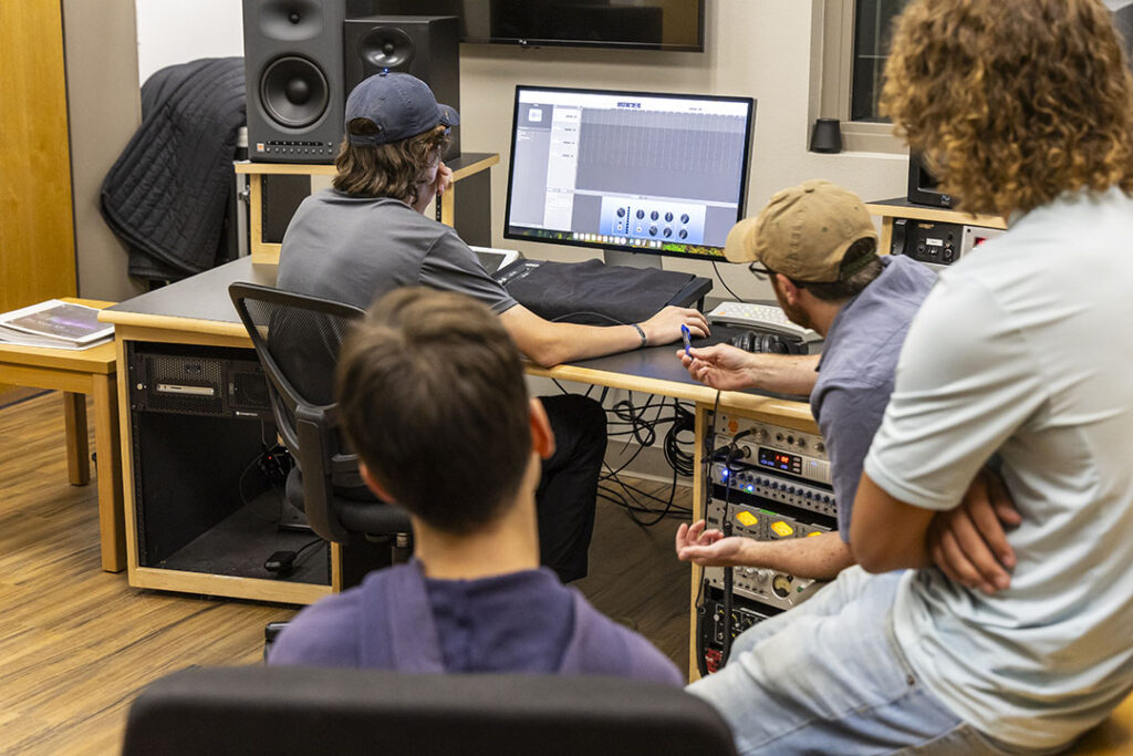 Students in the control room of the recording studio.