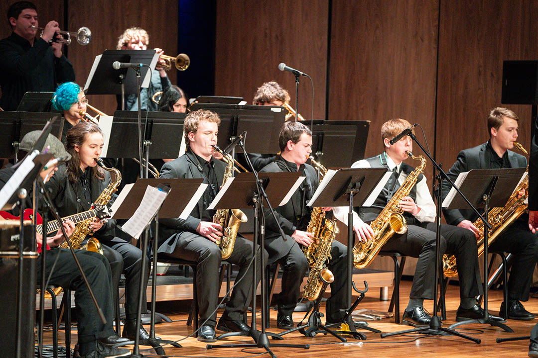 Wyoming All-State Jazz Band performing in 2025. Several students visible playing wind instruments.