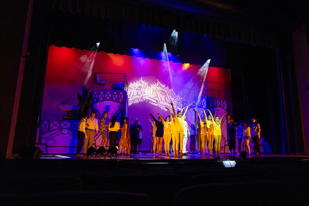 colorful lighting and set design on stage in Kinnison Hall