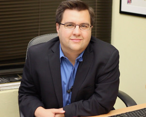 Photo of Michael Cassara at his desk