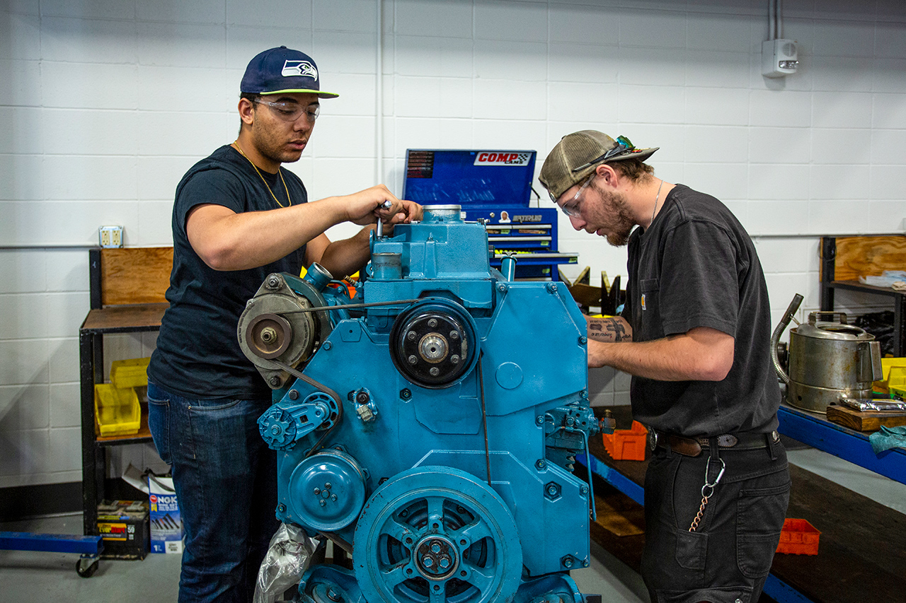Sheridan College Diesel Technology students work on an engine.