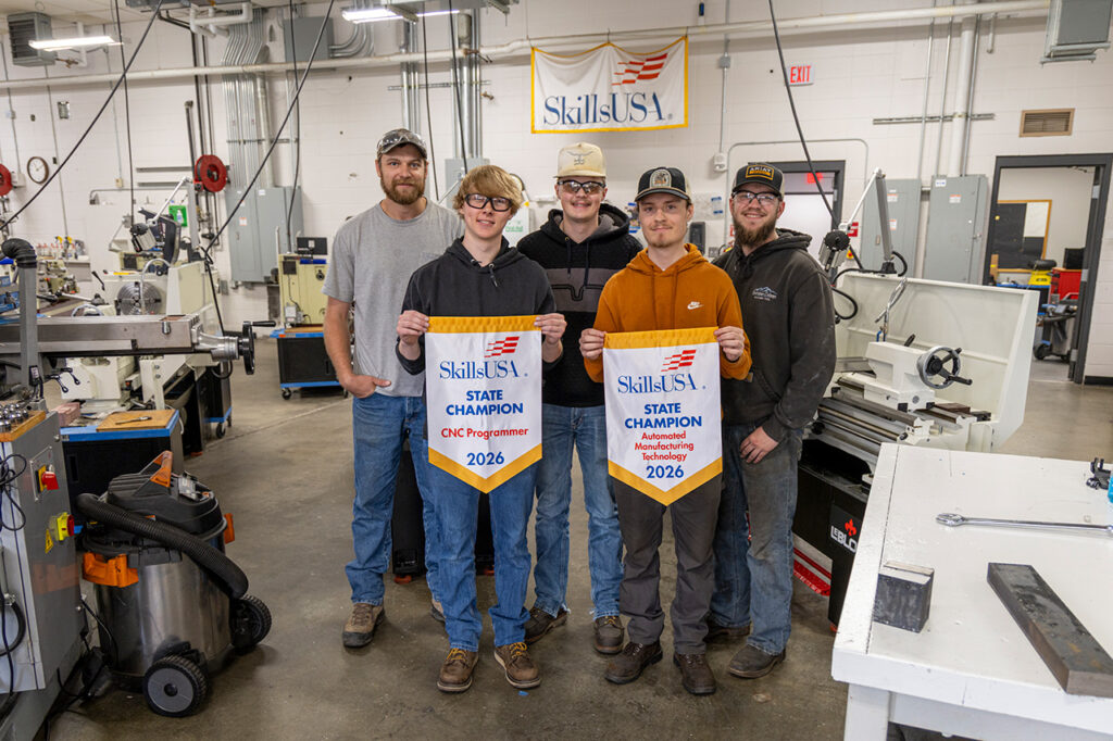 Sheridan College students holding the SkillsUSA they received.