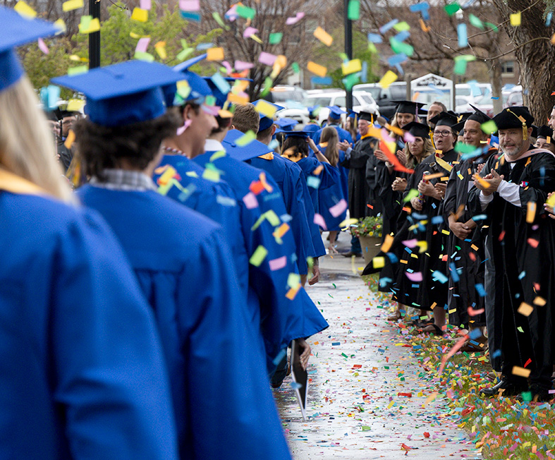 Sheridan College faculty congratulated new graduates after commencement 2026.