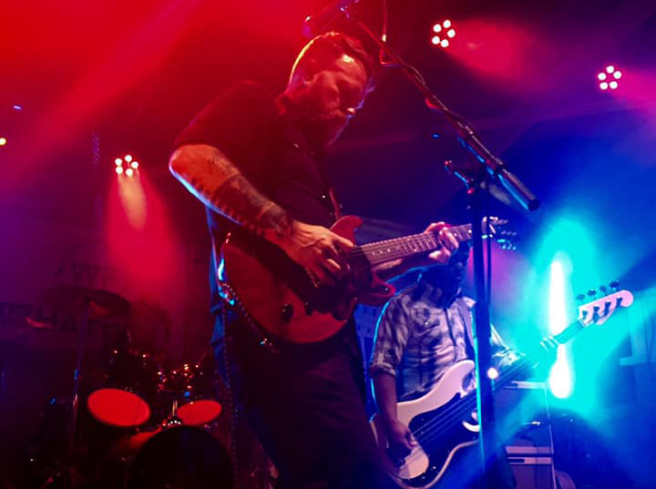 Bob Lefevre and the Already Gone, colorful lights on stage image