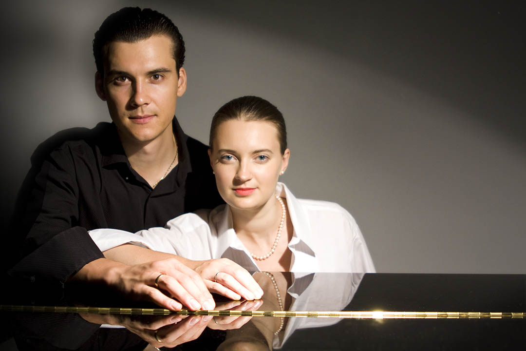 Photo of Shelest Piano duo sitting at the piano
