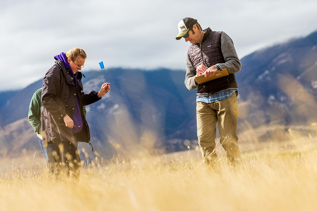Ecology instructor Scott Newbold with students.