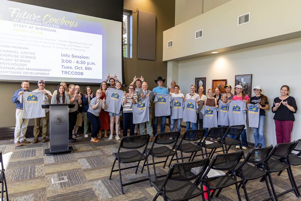group of students, faculty and staff gathered for future cowboys express transfer info meeting