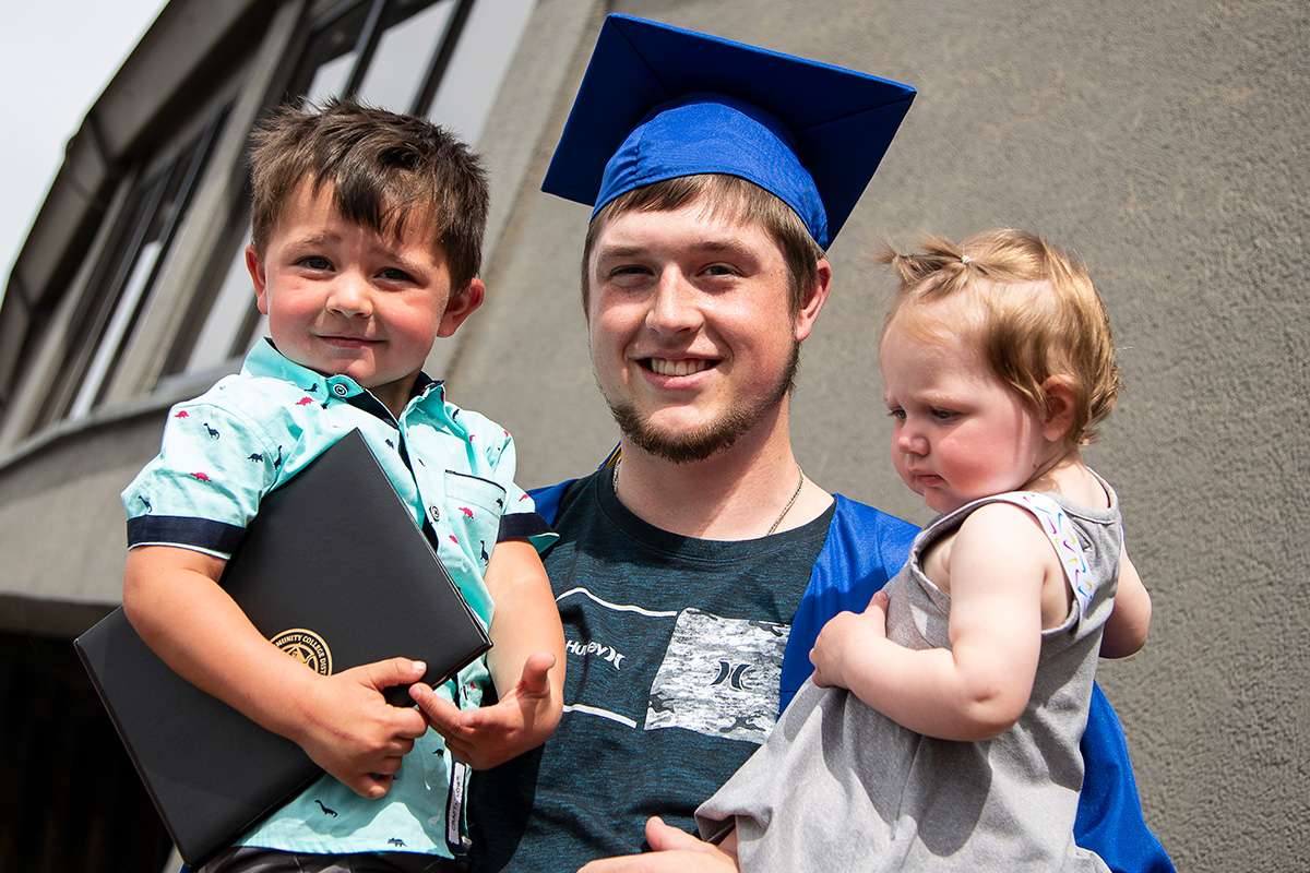 graduate with kids photo